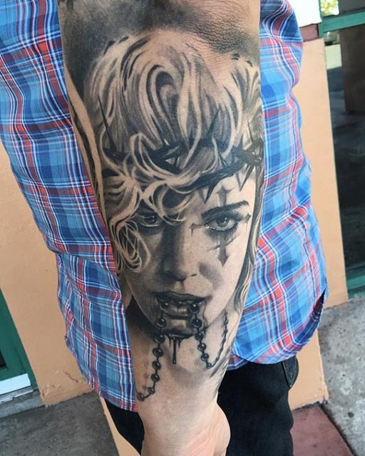 arm tattoo face chicano